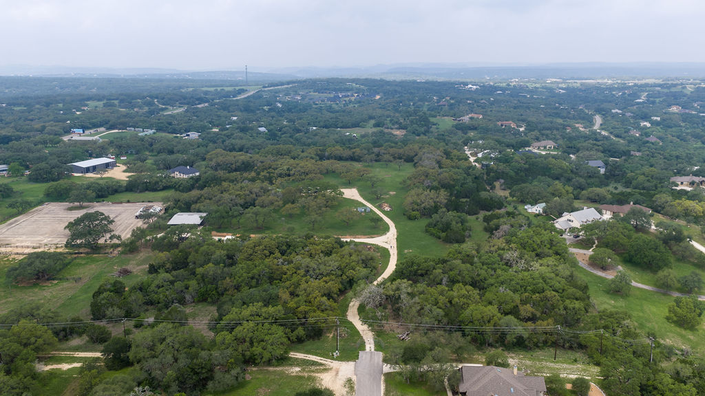 426 Mill Run New Braunfels, TX 78132 - Photo 9 of 40 an aerial view of a house with a yard