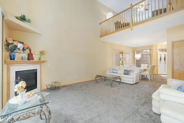 a living room with furniture and a fireplace