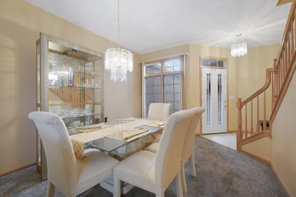 a dining room with furniture and window