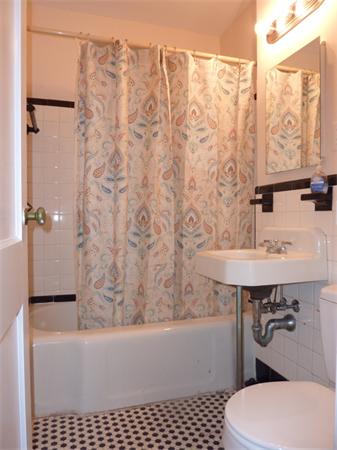 150 Beaconsfield Road, Unit 5 Brookline, MA 02445 - Photo 7 of 7 a bathroom with a sink a toilet a mirror and shower