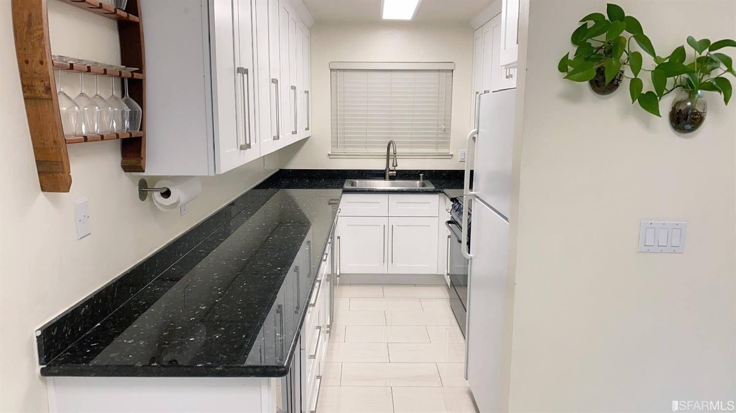 420 Camelback Road Pleasant Hill, CA 94523 - Photo 4 of 32 a kitchen with a white stove top oven and a granite counter tops