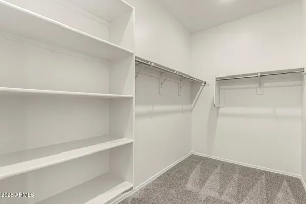 a view of an empty walk in closet