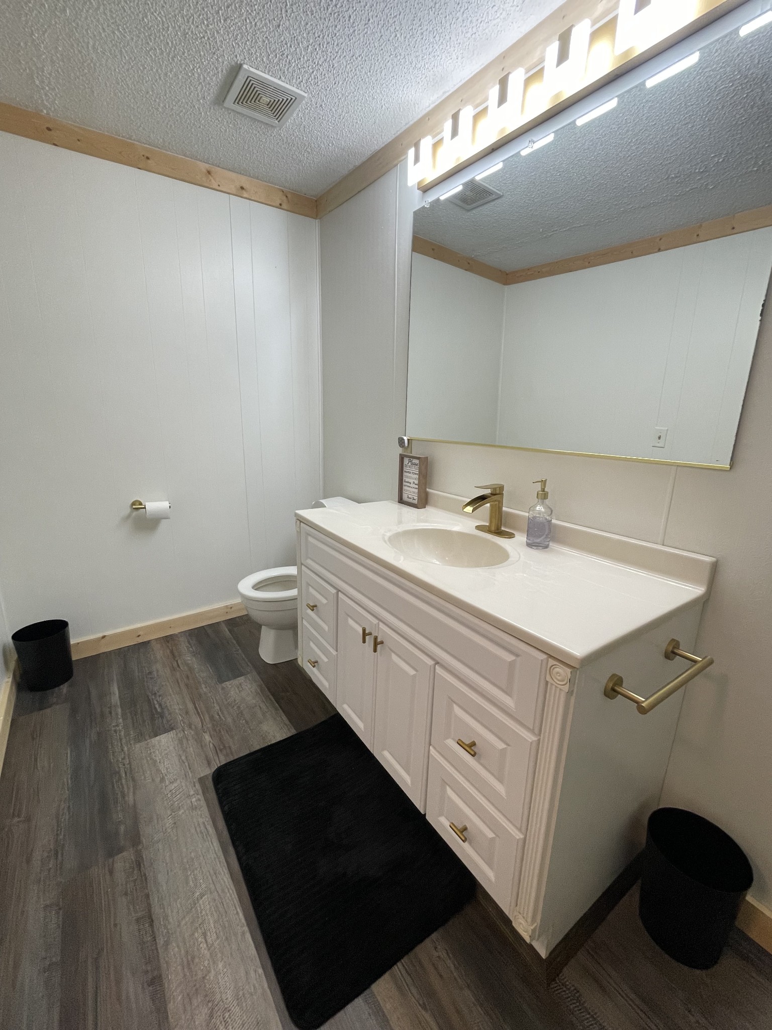 4875 Dollar Road Buena Vista, TN 38318 - Photo 14 of 29 a utility room with a sink a toilet and a mirror