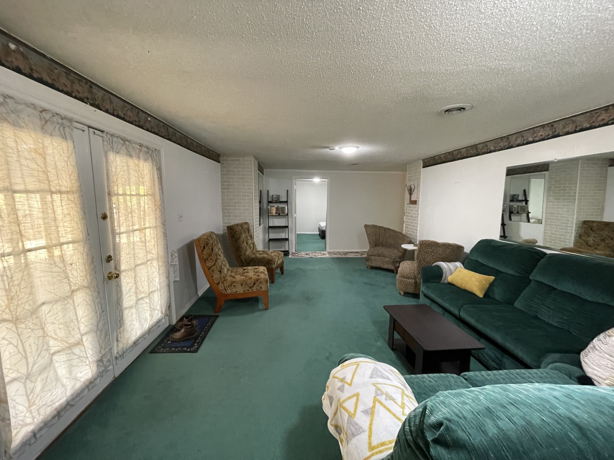 4875 Dollar Road Buena Vista, TN 38318 - Photo 22 of 29 a living room with furniture and a large window