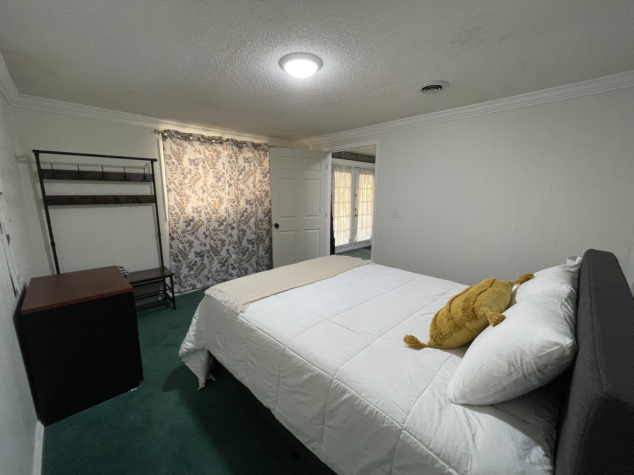4875 Dollar Road Buena Vista, TN 38318 - Photo 23 of 29 a bedroom with a bed and a chair