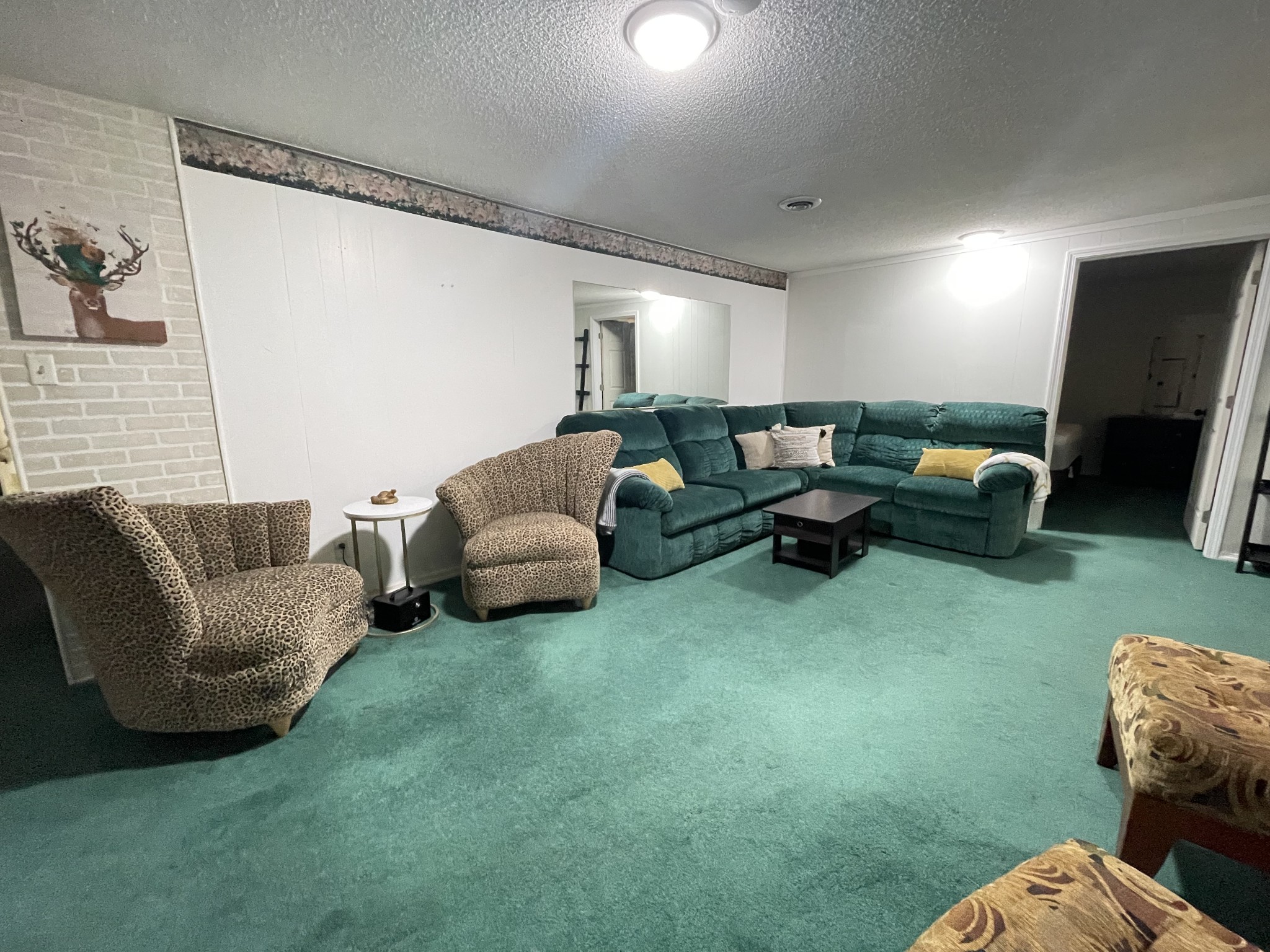 4875 Dollar Road Buena Vista, TN 38318 - Photo 4 of 29 a living room with furniture and a flat screen tv