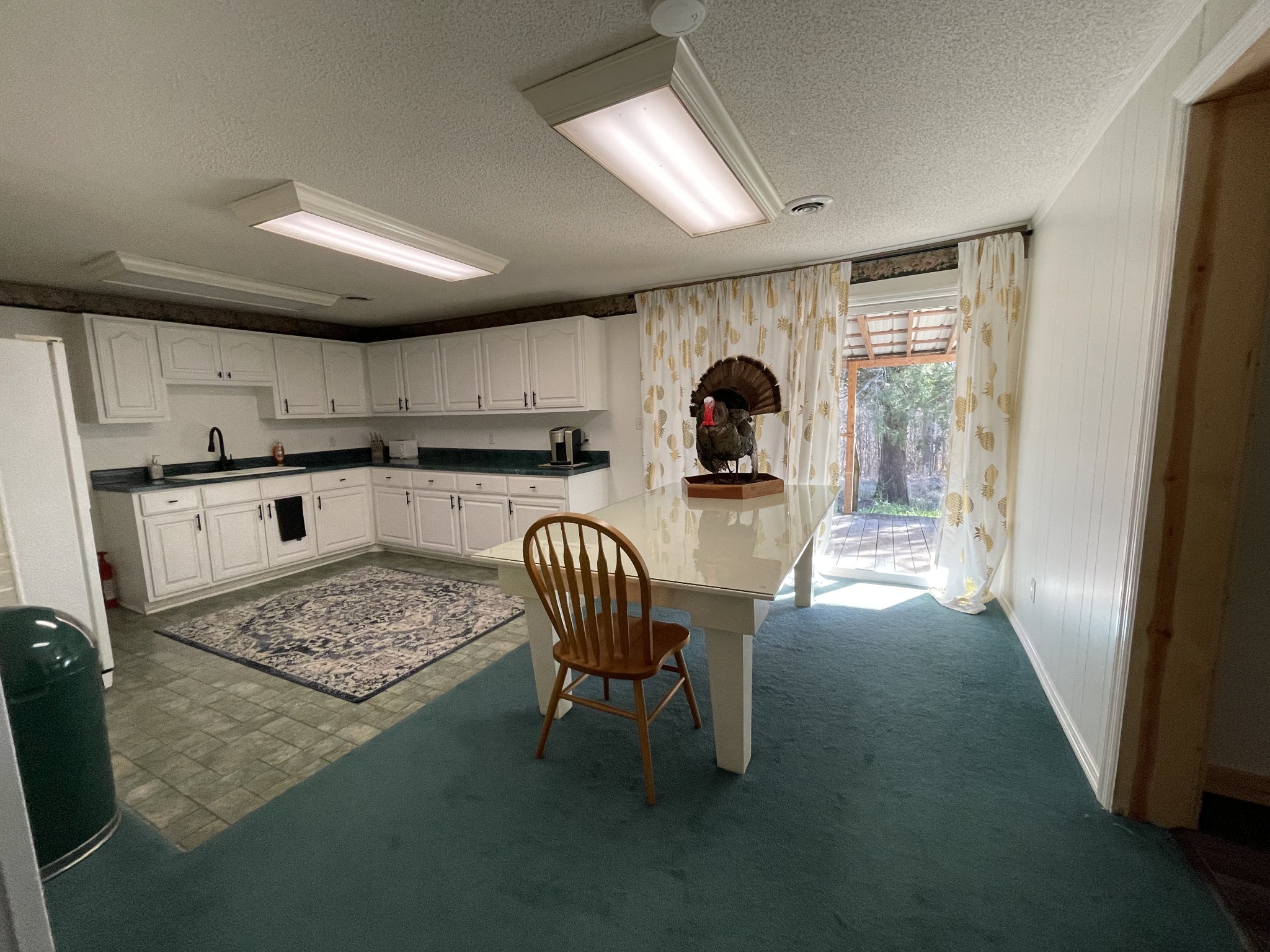 4875 Dollar Road Buena Vista, TN 38318 - Photo 7 of 29 a kitchen with stainless steel appliances granite countertop a stove top oven a sink and a dining table