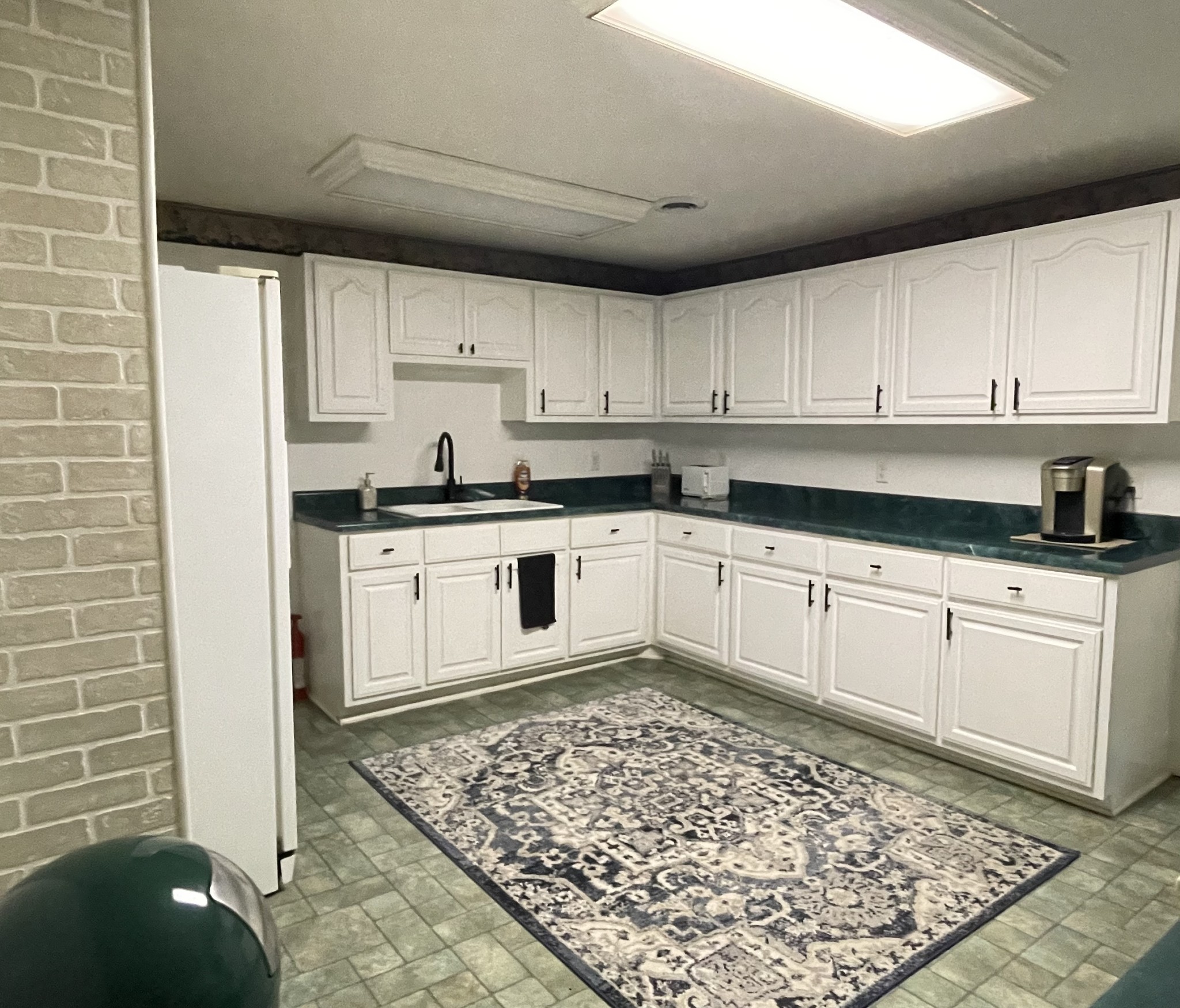 4875 Dollar Road Buena Vista, TN 38318 - Photo 9 of 29 a kitchen with stainless steel appliances granite countertop a refrigerator sink and cabinets