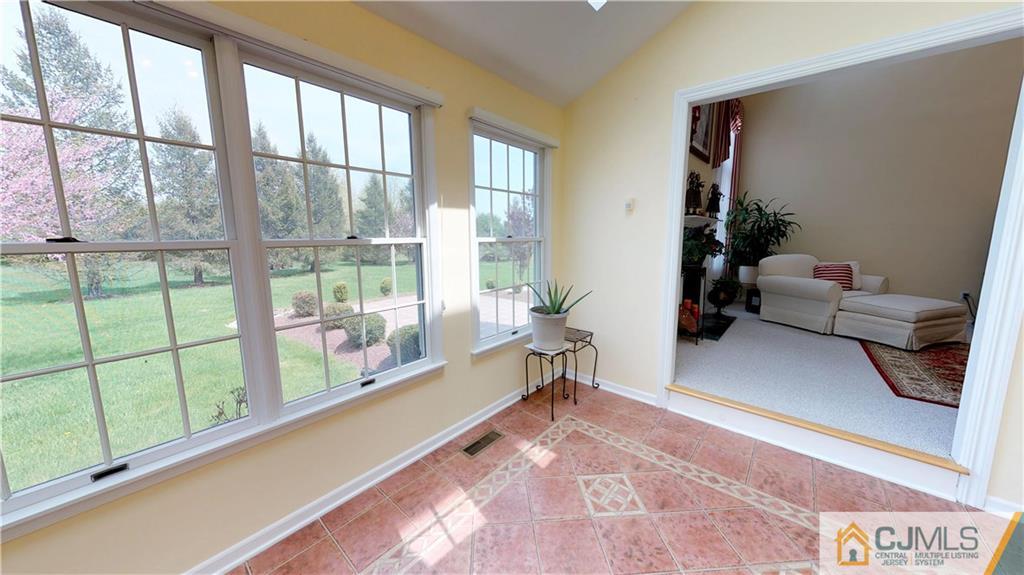39 Zaitz Farm Road West Windsor, NJ 08550 - Photo 12 of 24 a living room with furniture and a large window