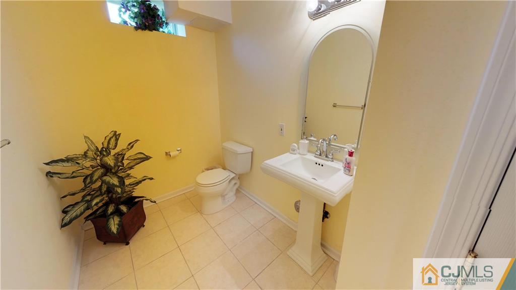 39 Zaitz Farm Road West Windsor, NJ 08550 - Photo 13 of 24 a bathroom with a sink mirror and toilet