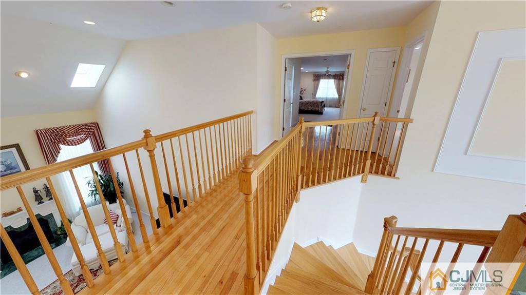 39 Zaitz Farm Road West Windsor, NJ 08550 - Photo 14 of 24 a view of staircase with railing and a wooden floor