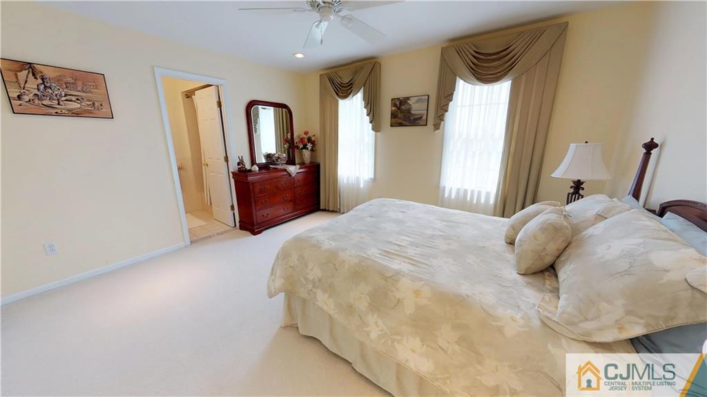 39 Zaitz Farm Road West Windsor, NJ 08550 - Photo 15 of 24 a bedroom with a bed and a mirror on dresser