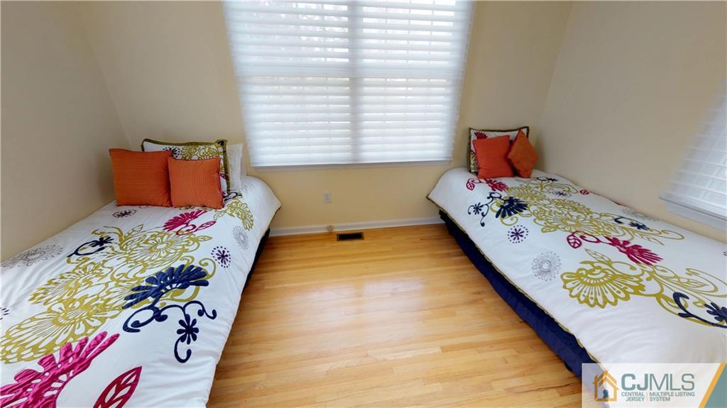 39 Zaitz Farm Road West Windsor, NJ 08550 - Photo 16 of 24 a bed sitting in a bedroom next to a window