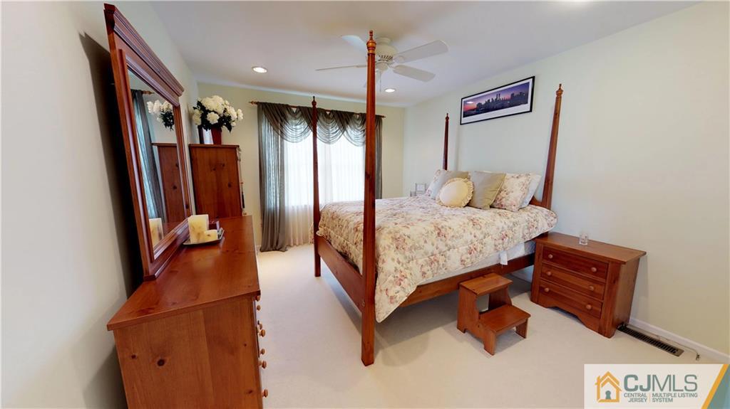 39 Zaitz Farm Road West Windsor, NJ 08550 - Photo 19 of 24 a bedroom with a bed and a dresser in it