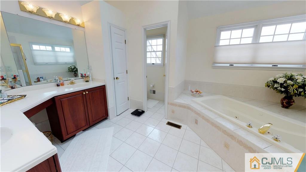 39 Zaitz Farm Road West Windsor, NJ 08550 - Photo 21 of 24 a spacious bathroom with a tub sink and mirror