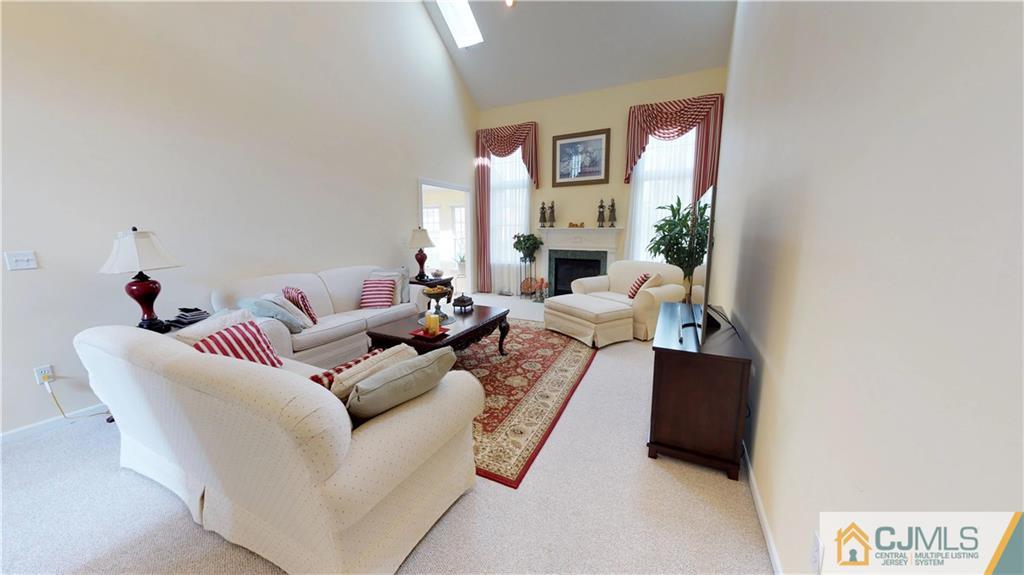 39 Zaitz Farm Road West Windsor, NJ 08550 - Photo 9 of 24 a living room with furniture a fireplace and a potted plant
