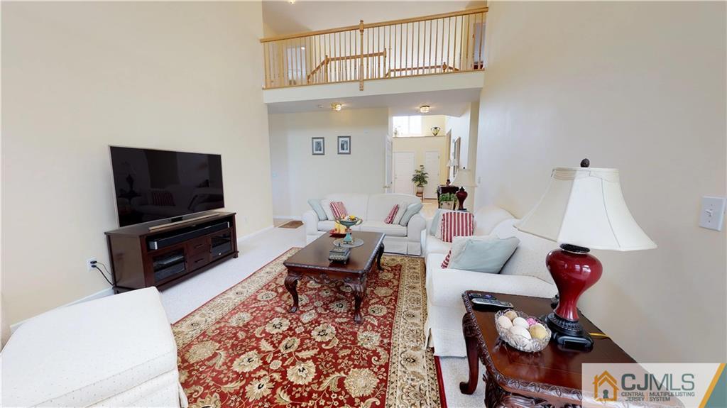 39 Zaitz Farm Road West Windsor, NJ 08550 - Photo 10 of 24 a living room with furniture and a flat screen tv