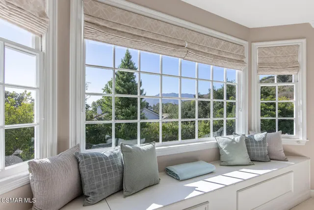 a living room with furniture and windows