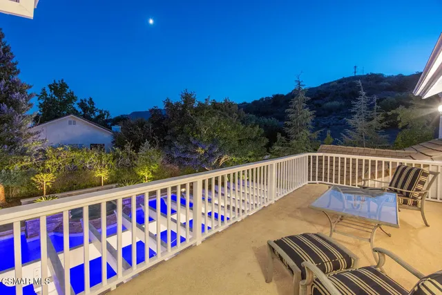 a view of balcony with wooden floor and outdoor space