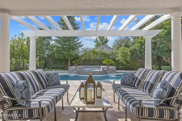 a view of a patio with couches chairs and a table