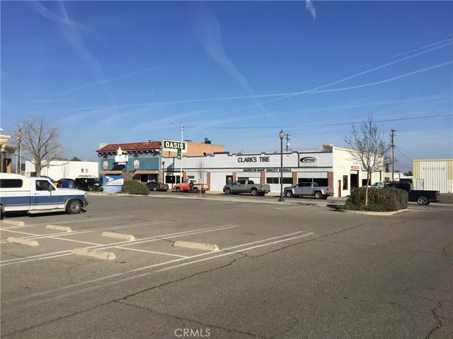 a view of street with parked cars