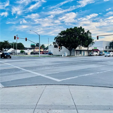 a view of street with parked cars