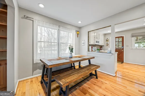 a room with wooden floor and furniture
