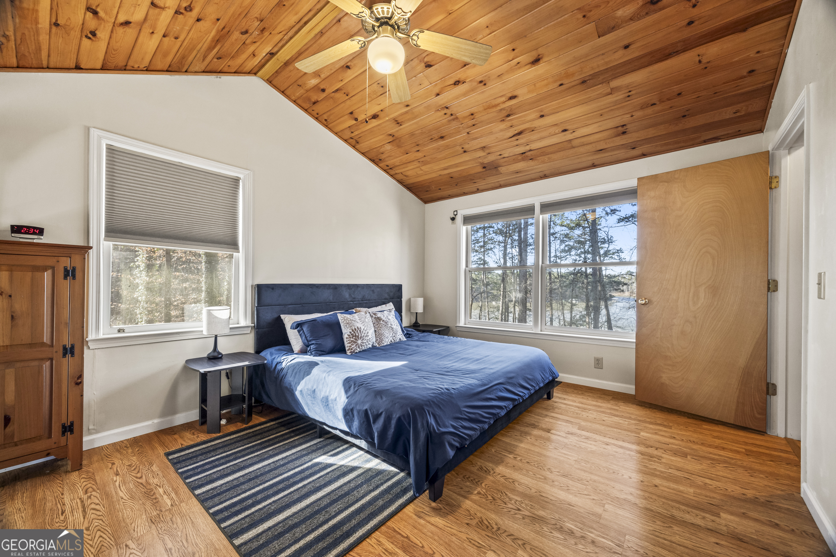 59 Waters Edge Extension Martin, GA 30557 - Photo 35 of 48 a spacious bedroom with a bed and wooden floor