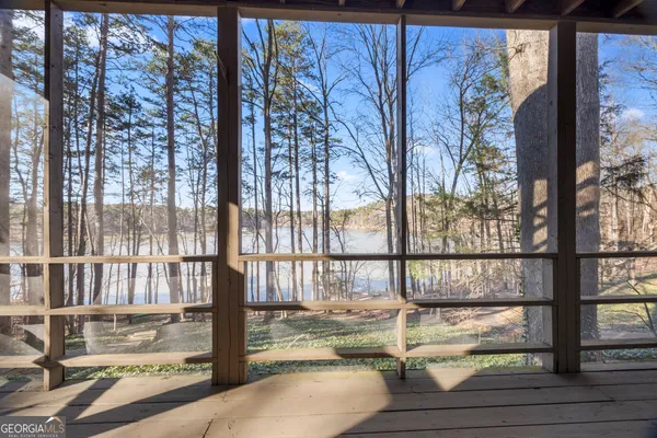 a view of a porch with a floor to ceiling window