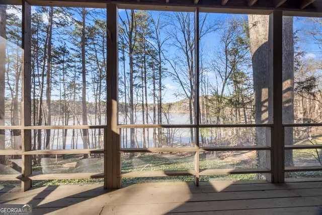 a view of a porch with a floor to ceiling window