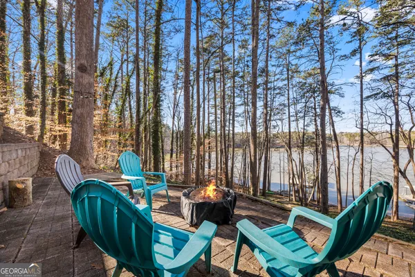 a view of two chairs in the patio