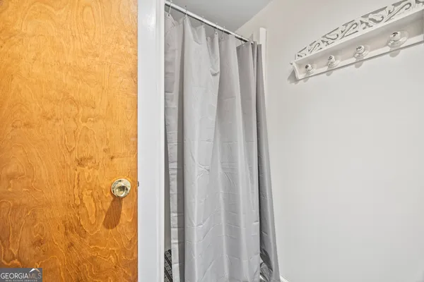 a bathroom with a shower and a tub