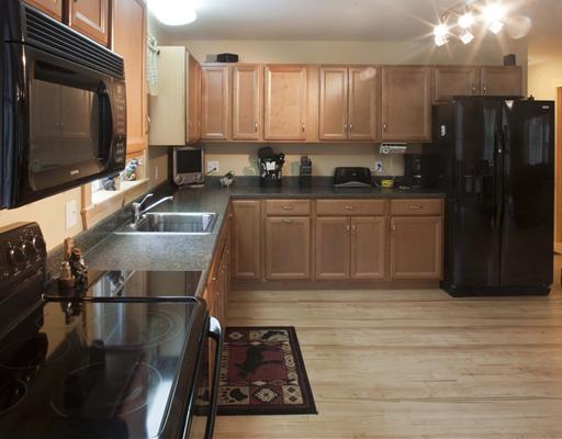 8 Beaver Brook Road Dover-Foxcroft, ME 04426 - Photo 7 of 25 Kitchen. Appointed with black appliances