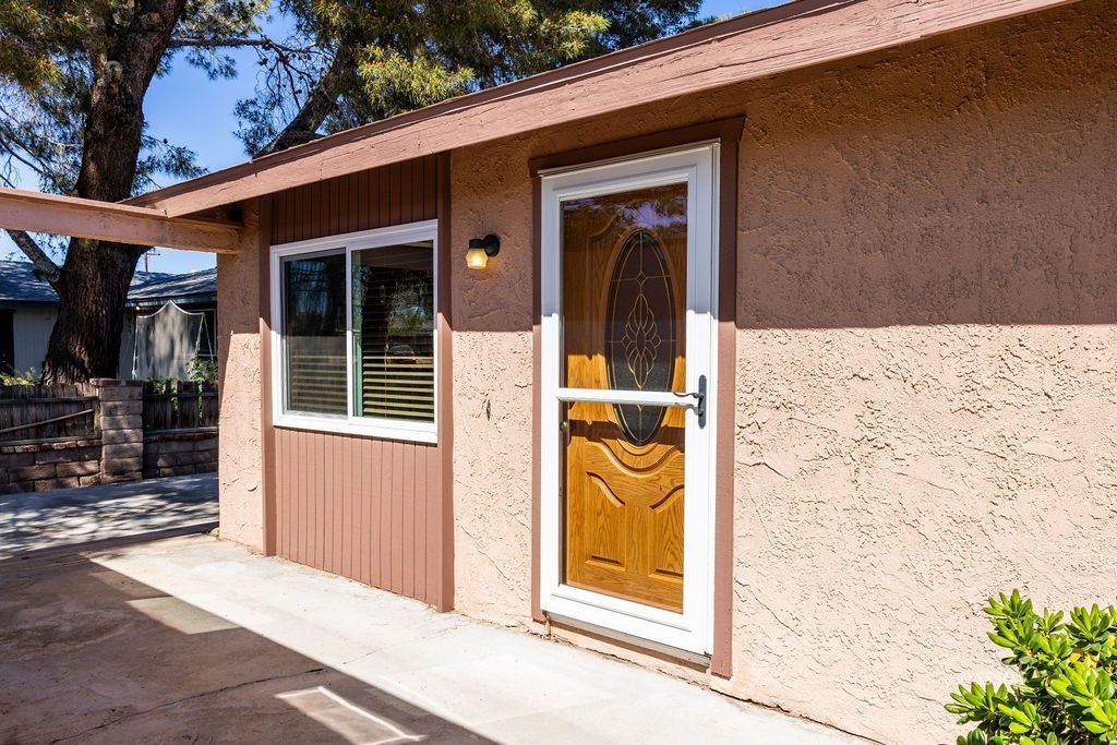 1144 West Benson Avenue Ridgecrest, CA 93555 - Photo 6 of 32 a couple of potted plant in front of a door