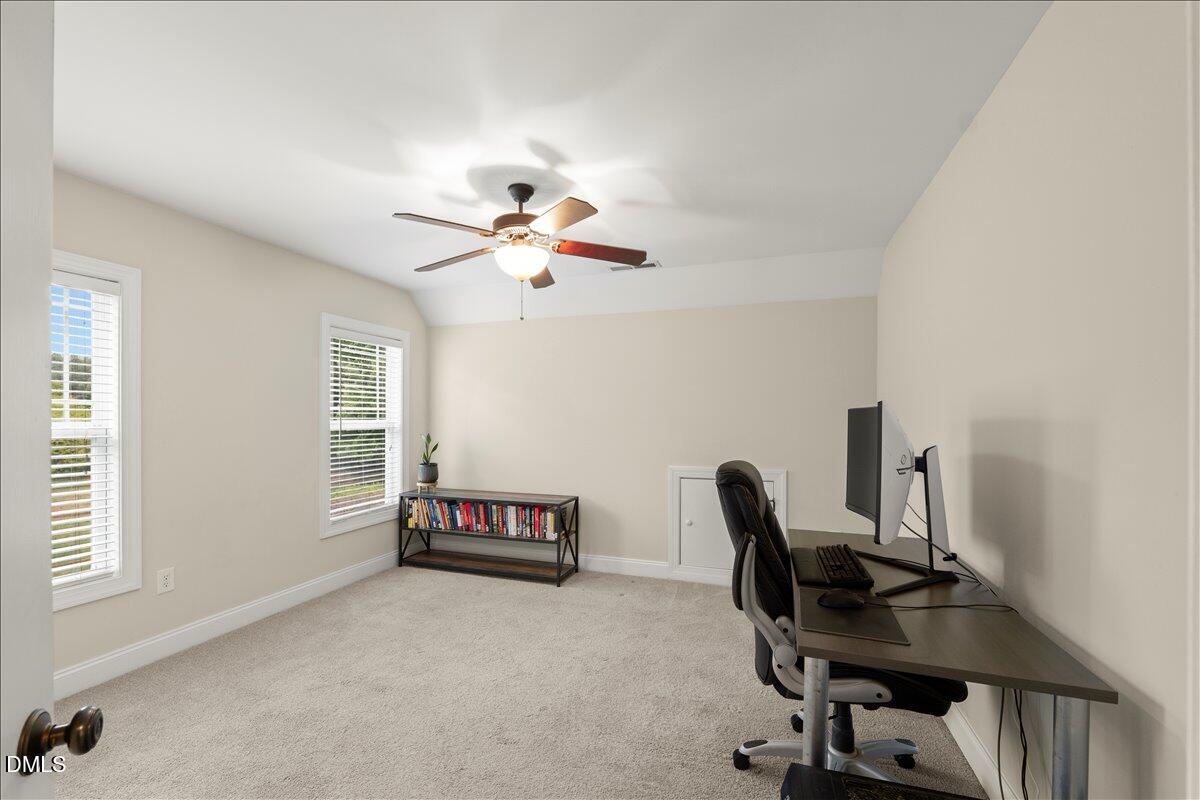7400 Denlee Road Raleigh, NC 27603 - Photo 27 of 47 a view of a workspace with furniture and a window