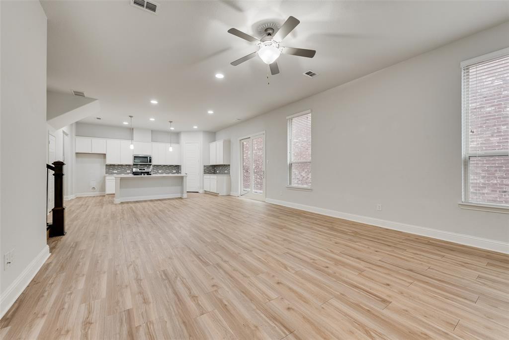 628 Ansley Way Allen, TX 75013 - Photo 7 of 20 Bright open-concept living area featuring wood-finish flooring, recessed lighting, and a ceiling fan