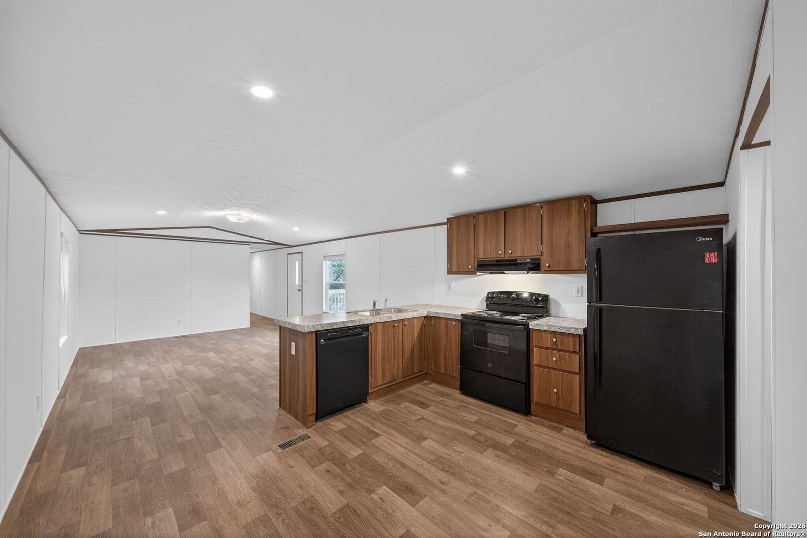 Lot 38 Pr 1510 Bandera, TX 78003 - Photo 14 of 30 a kitchen with stainless steel appliances granite countertop a refrigerator and a stove top oven