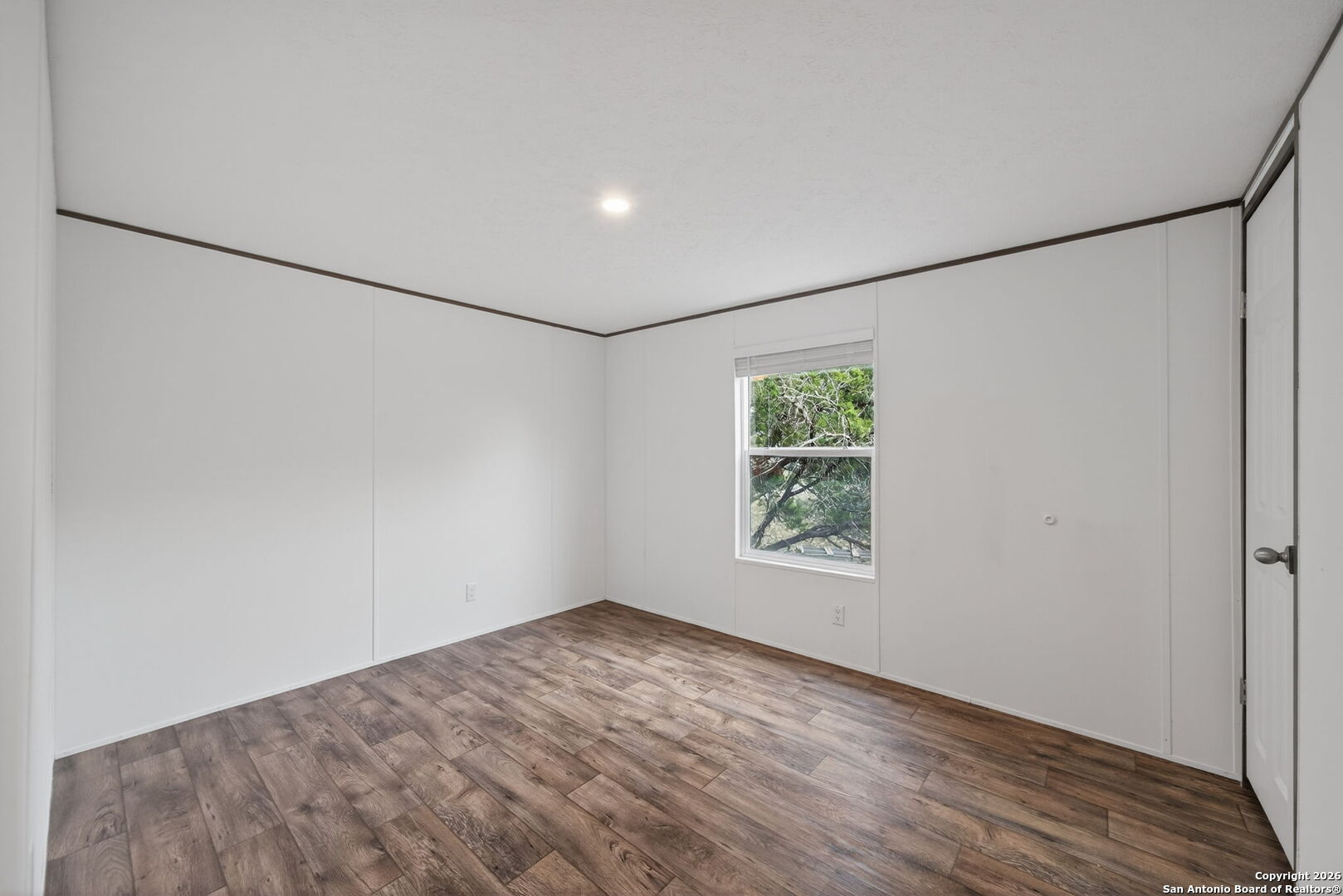 Lot 38 Pr 1510 Bandera, TX 78003 - Photo 19 of 30 a view of a big room with wooden floor and windows