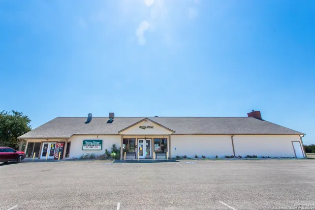 a room with lots of furniture and clutter