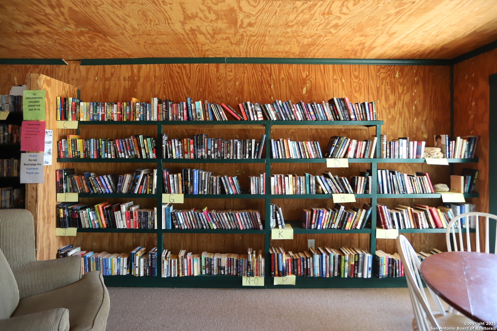 Lot 38 Pr 1510 Bandera, TX 78003 - Photo 26 of 30 a book shelf with chairs in a room
