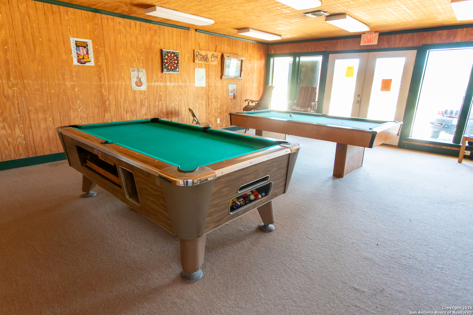 Lot 38 Pr 1510 Bandera, TX 78003 - Photo 27 of 30 a room with pool table and a floor to ceiling window