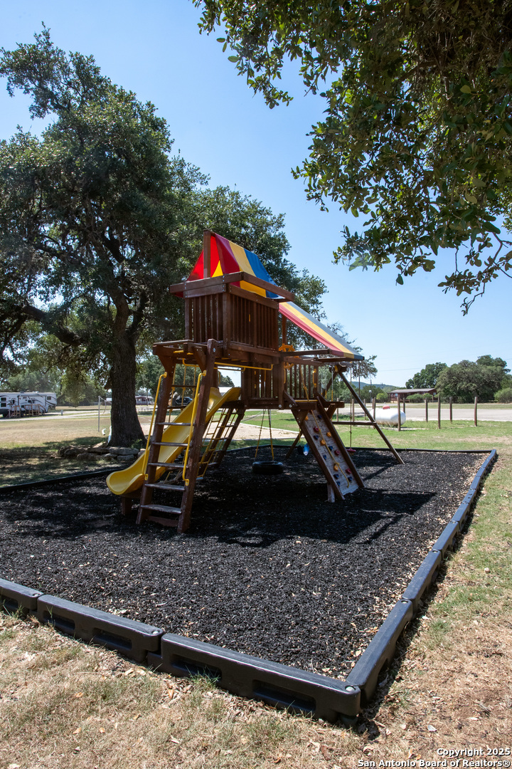 Lot 38 Pr 1510 Bandera, TX 78003 - Photo 28 of 30 a view of a wooden deck with a yard