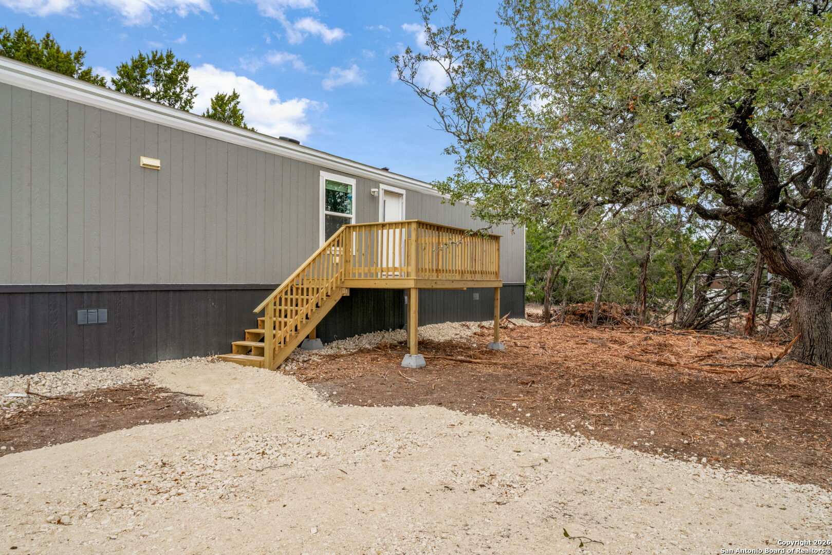 Lot 38 Pr 1510 Bandera, TX 78003 - Photo 4 of 30 a wooden bench sitting in middle of a yard