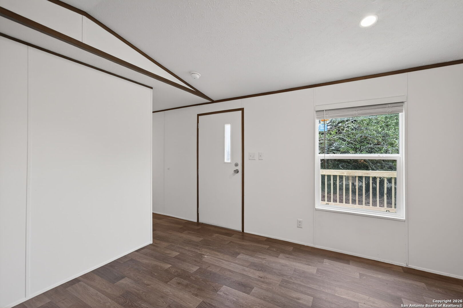 Lot 38 Pr 1510 Bandera, TX 78003 - Photo 6 of 30 a view of an empty room with a window and wooden floor