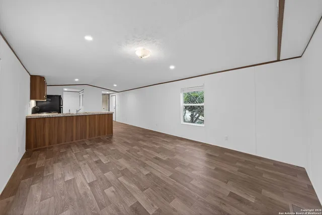 a view of a livingroom with wooden floor