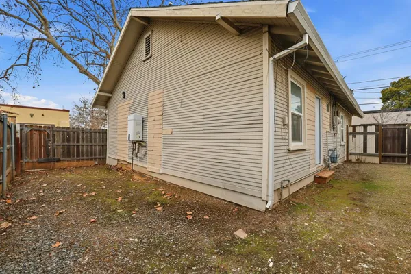 a view of a house next to a yard