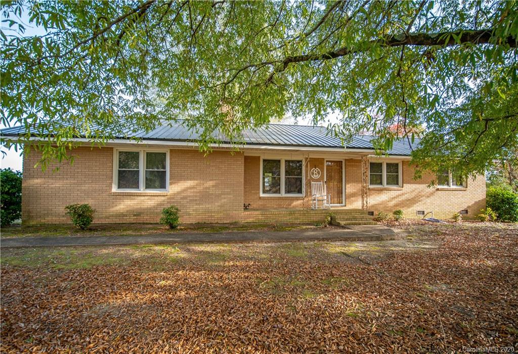1956 Tradesville Road Lancaster, SC 29720 - Photo 1 of 18 a view of a house with a backyard