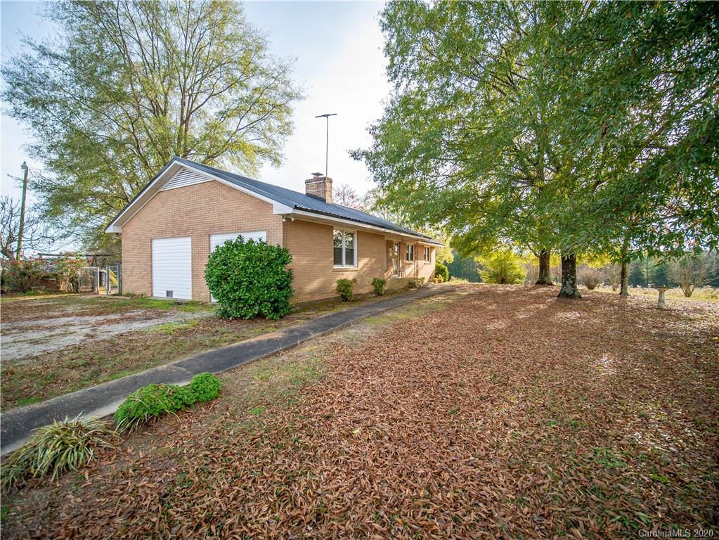 1956 Tradesville Road Lancaster, SC 29720 - Photo 2 of 18 a front view of a house with a yard and garage