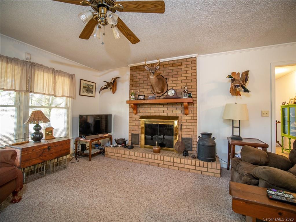 1956 Tradesville Road Lancaster, SC 29720 - Photo 4 of 18 a living room with furniture and a fireplace