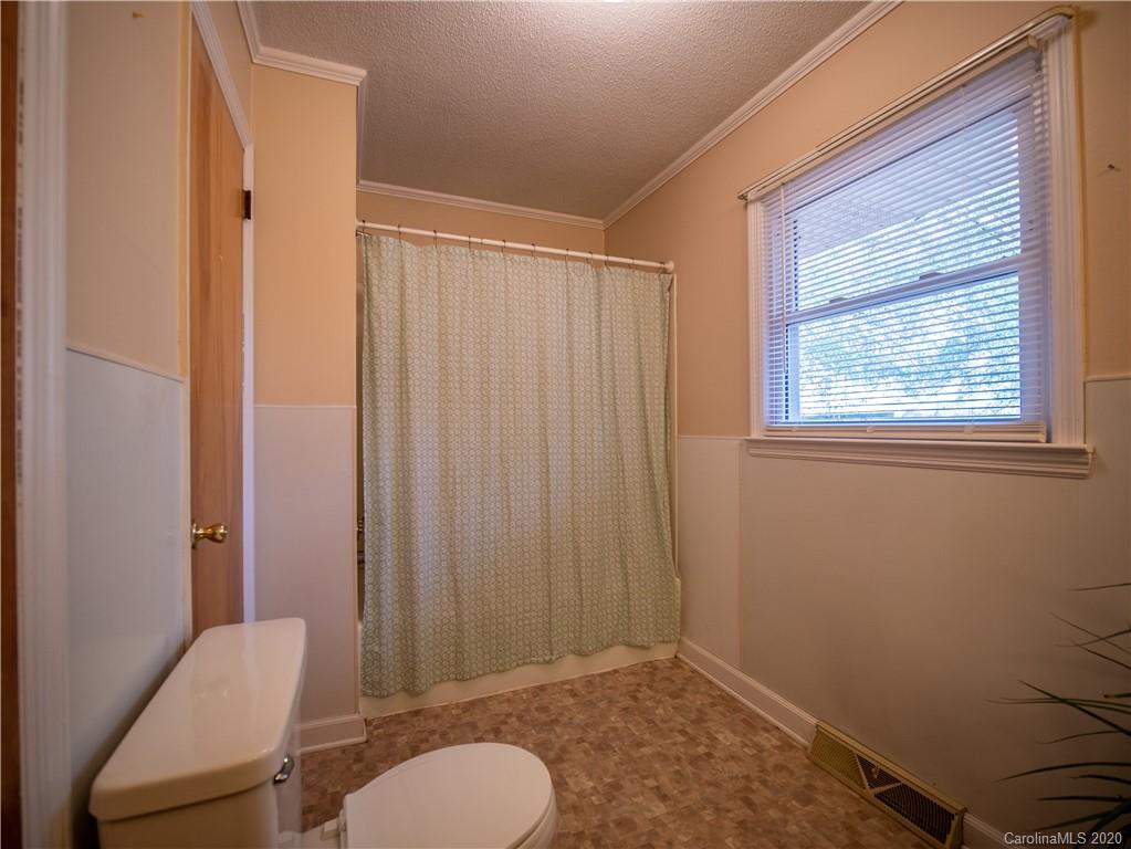 1956 Tradesville Road Lancaster, SC 29720 - Photo 6 of 18 a bathroom with a sink toilet and shower